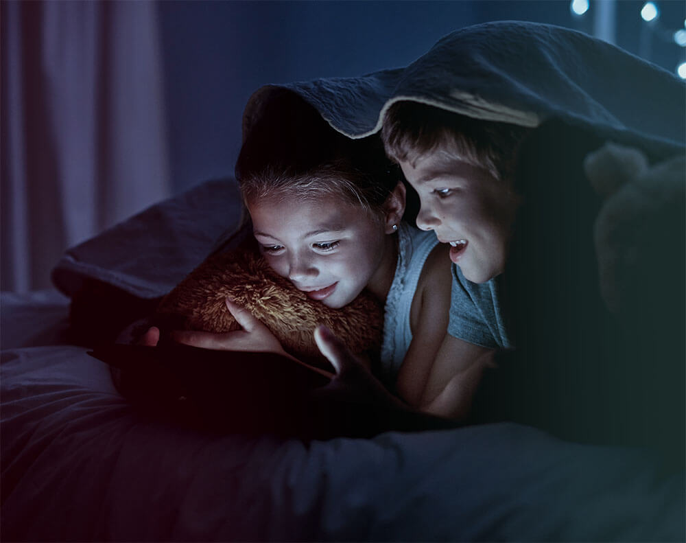 kid in wonder looking at a tablet_mob